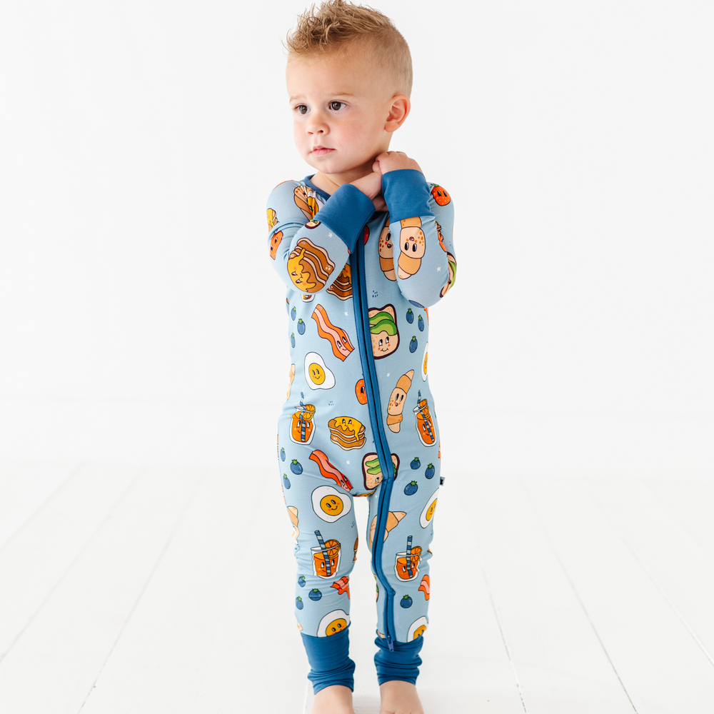 
                      
                        Baby in blue breakfast pajamas
                      
                    