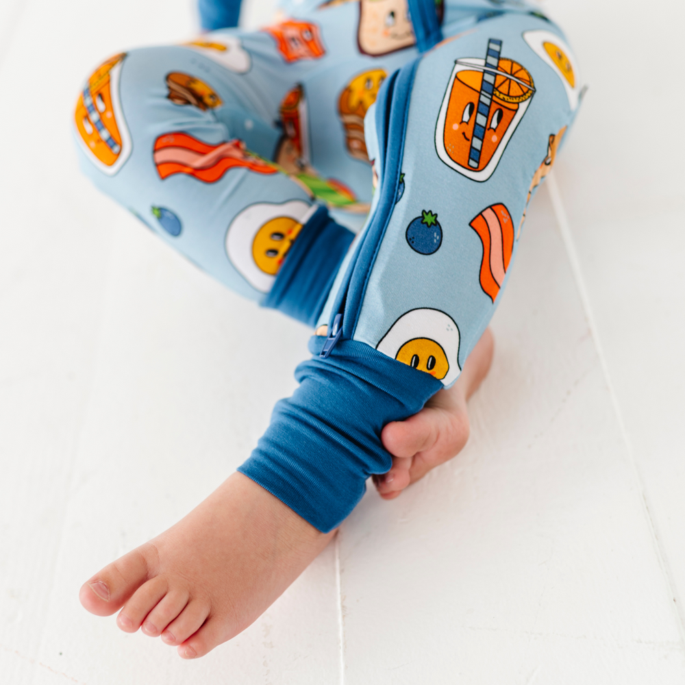 
                      
                        Baby in blue breakfast pajamas
                      
                    