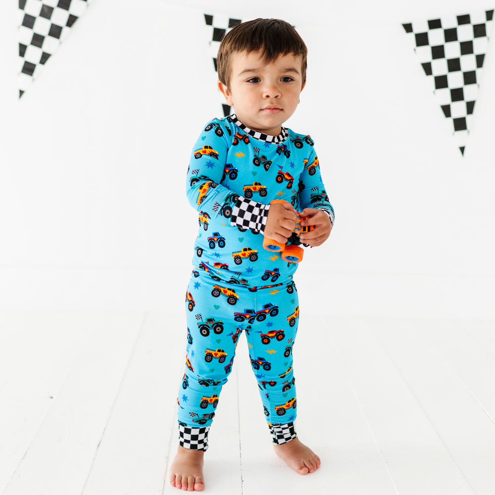 
                      
                        Boy in monster truck pajamas by Kiki and Lulu
                      
                    