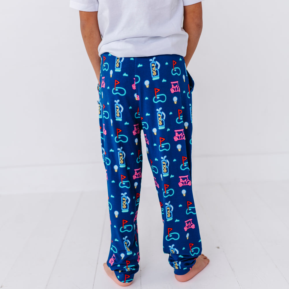 
                      
                        Boy Wearing Neon Golf Pajamas By Kiki Lulu
                      
                    