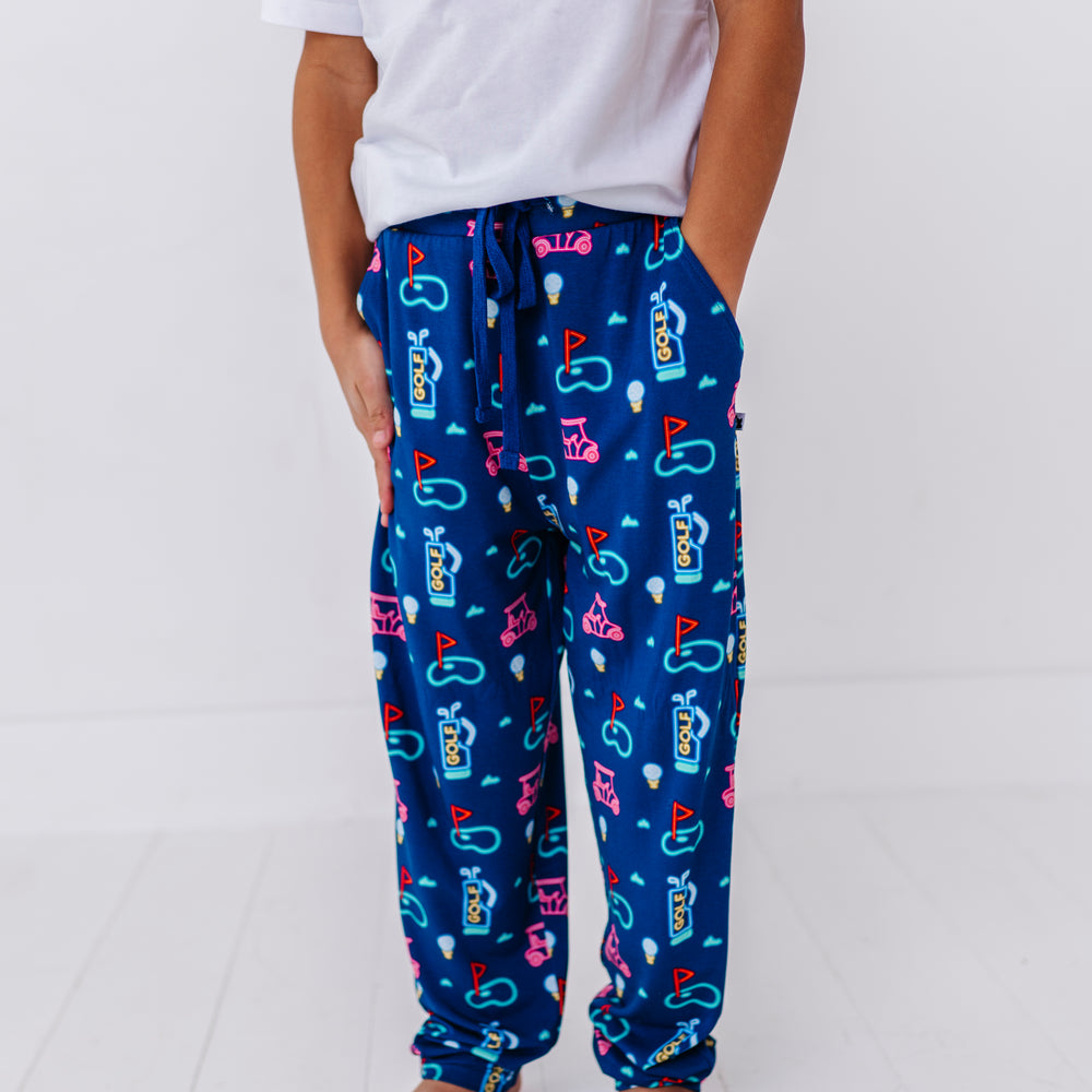 
                      
                        Boy in Neon Golf Pajamas By Kiki Lulu
                      
                    
