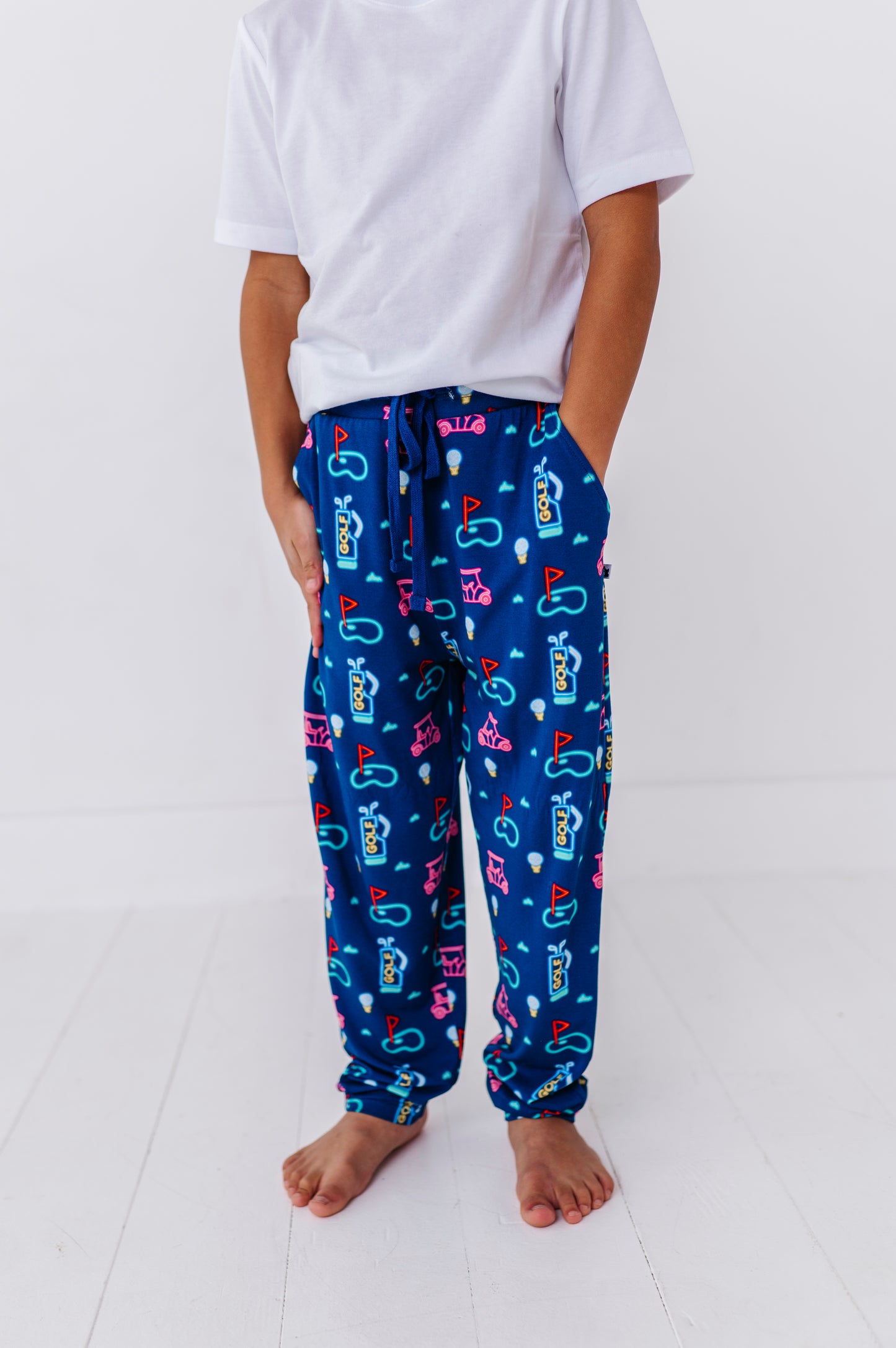 Boy in Neon Golf Pajamas By Kiki Lulu