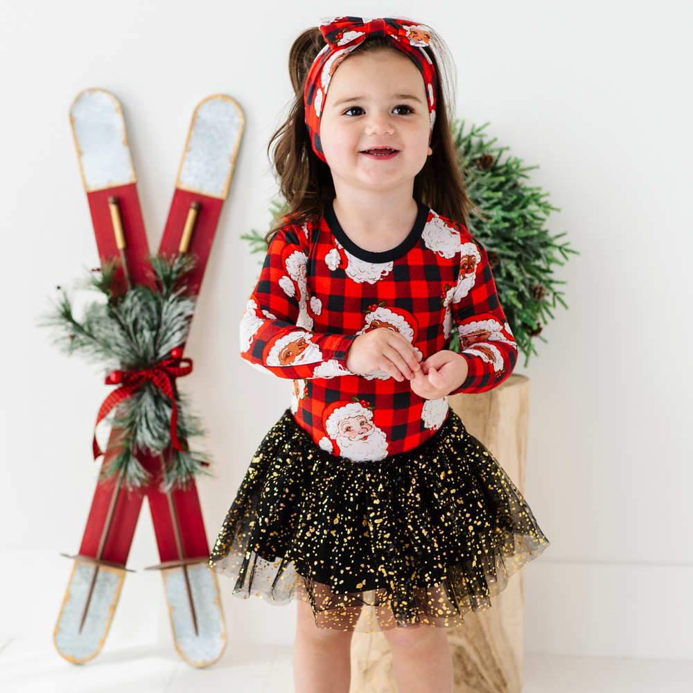 Girl in Christmas dress with tulle by Kiki and Lulu