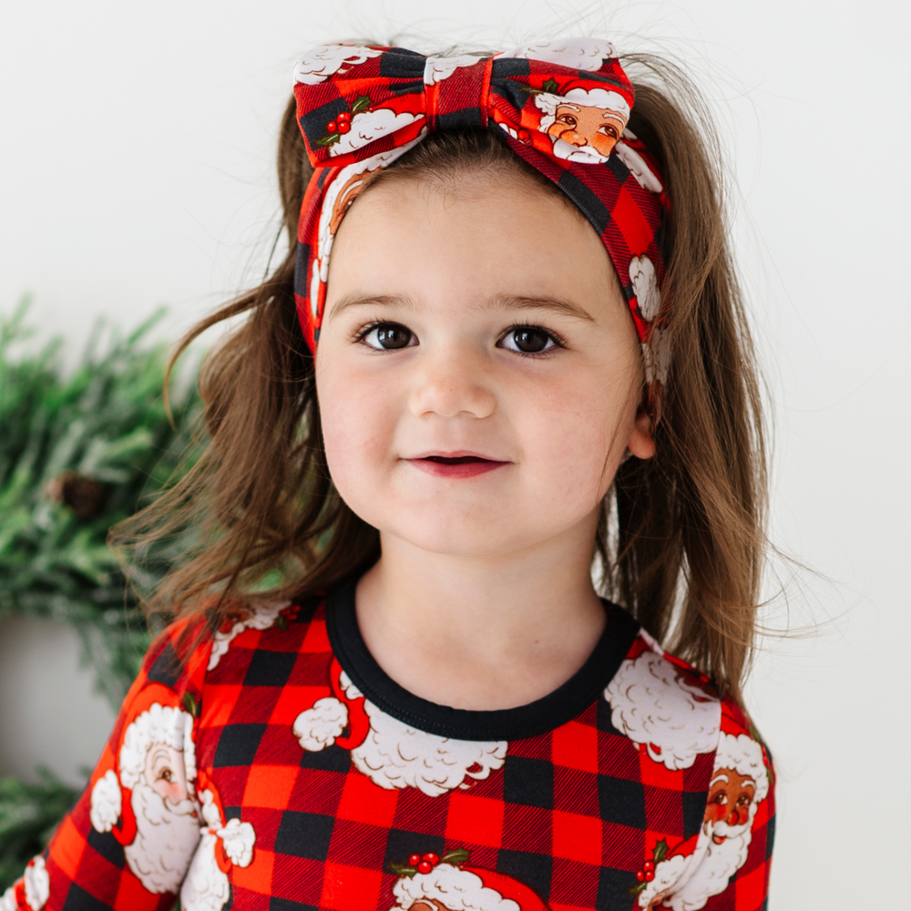 
                      
                        Girl in Santa bow by Kiki and Lulu
                      
                    