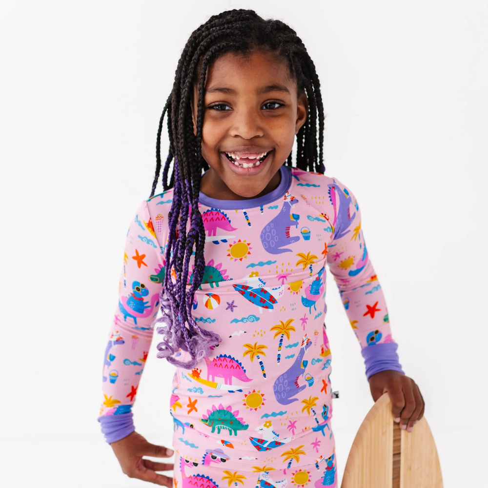 Pink dinosaur pajamas by Kiki and Lulu