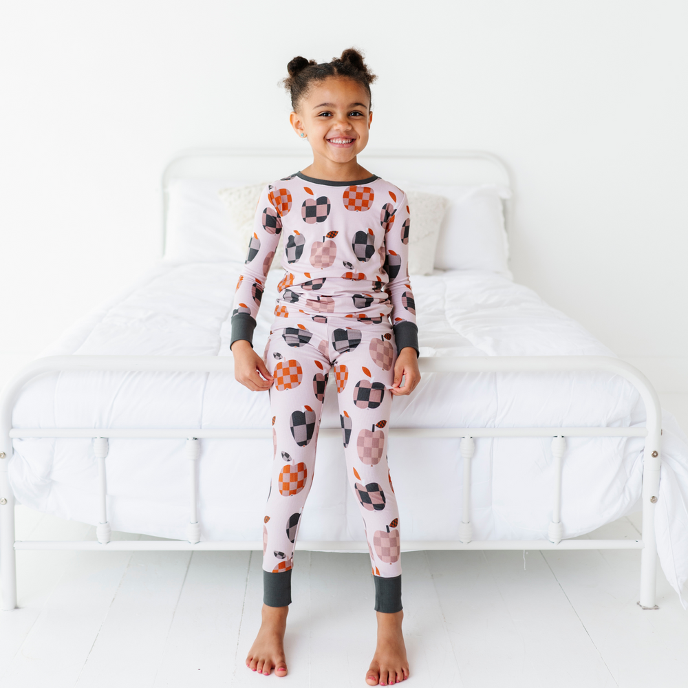 
                      
                        Girl Wearing Fall Apple Kids Pajamas
                      
                    