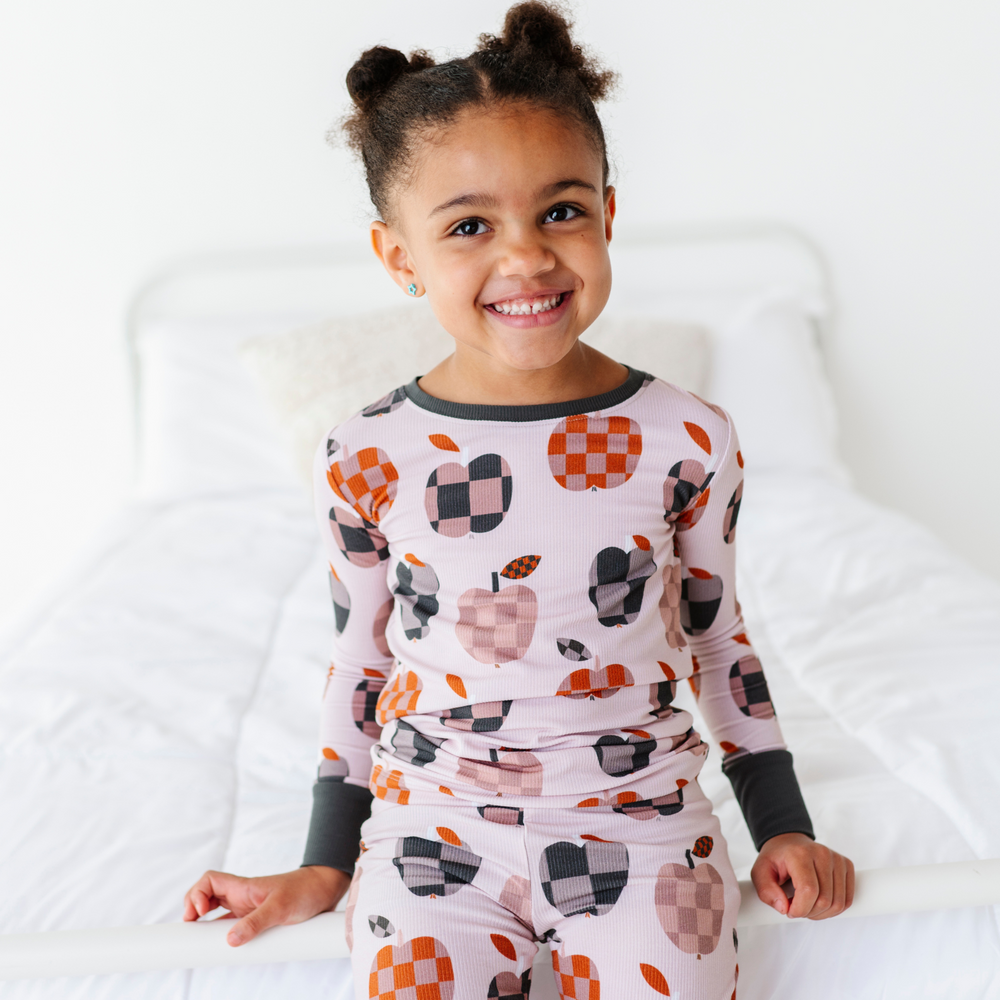 Girl Wearing Fall Apple Kids Pajamas