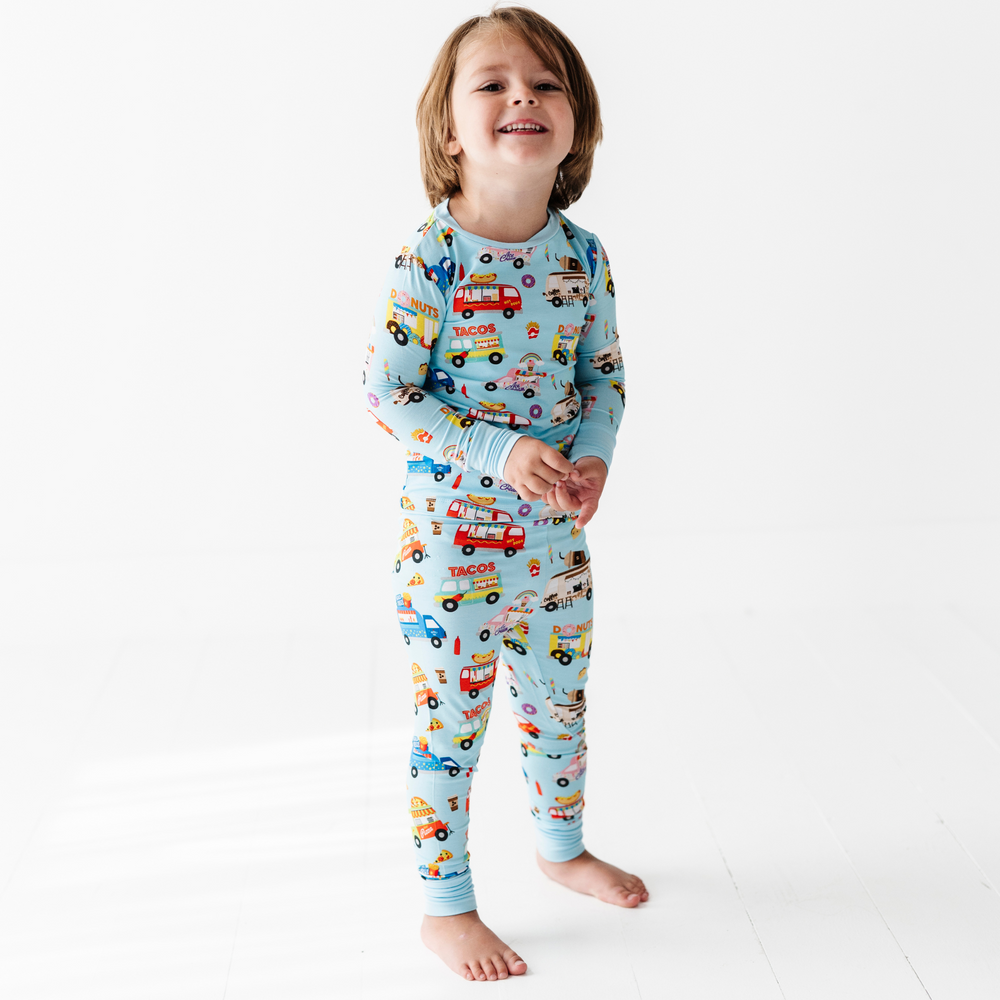 
                      
                        Kid in Kiki+Lulu Food Truck Pajamas
                      
                    