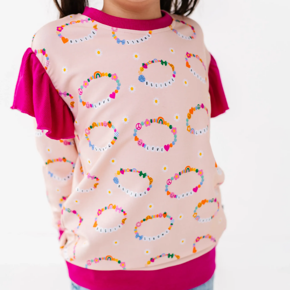 
                      
                        Friendship bracelet sweatshirt by Kiki and Lulu
                      
                    