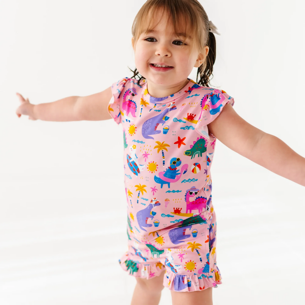 
                      
                        Girl in short pajama dinosaur set by Kiki and Lulu
                      
                    