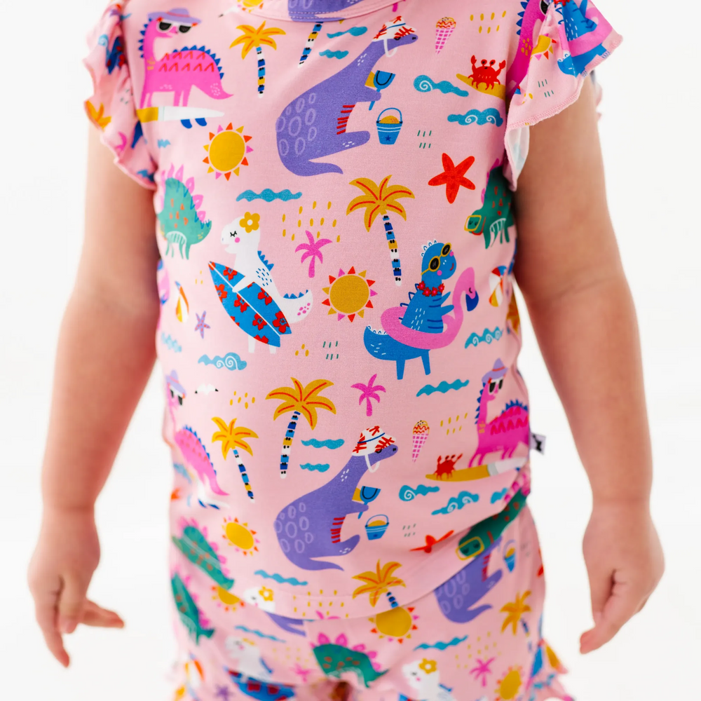 
                      
                        Girl in short pajama dinosaur set by Kiki and Lulu
                      
                    