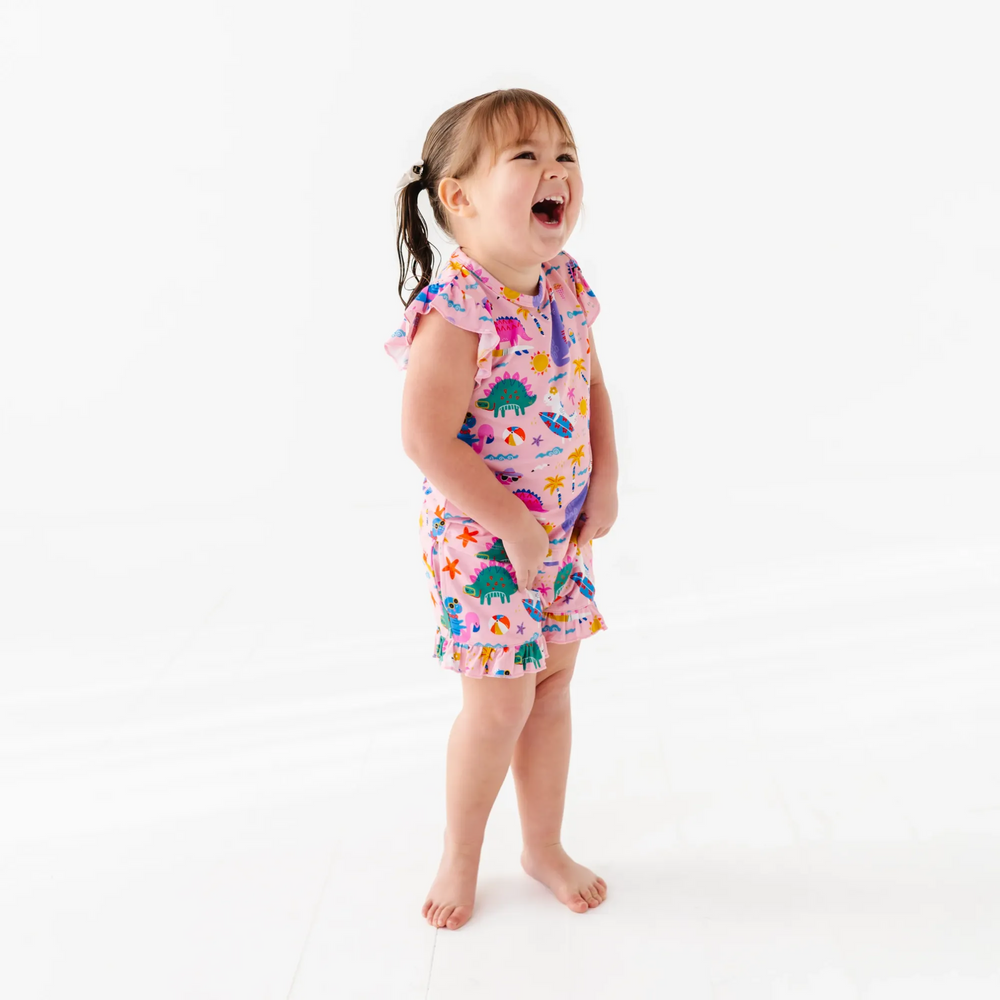 
                      
                        Girl in short pajama dinosaur set by Kiki and Lulu
                      
                    