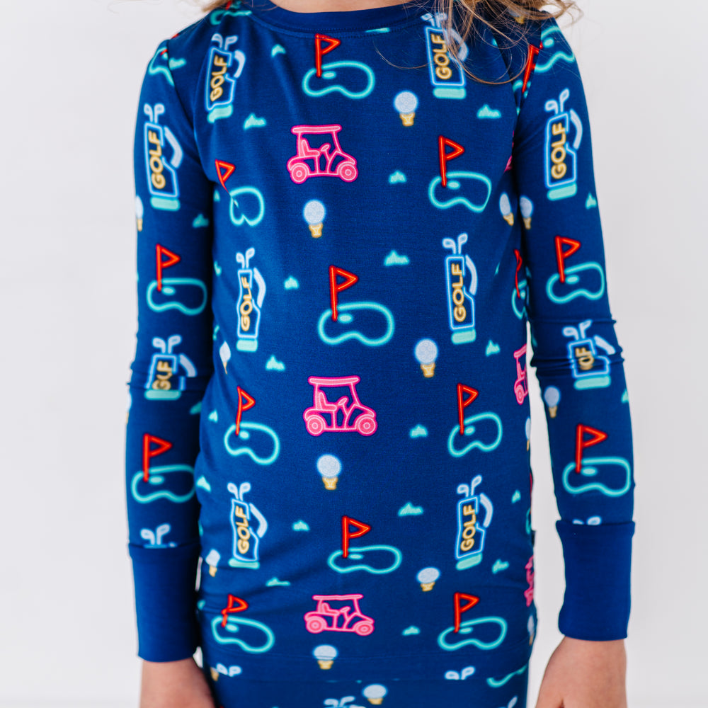 Girl in Neon Golf Pajamas by Kiki and Lulu