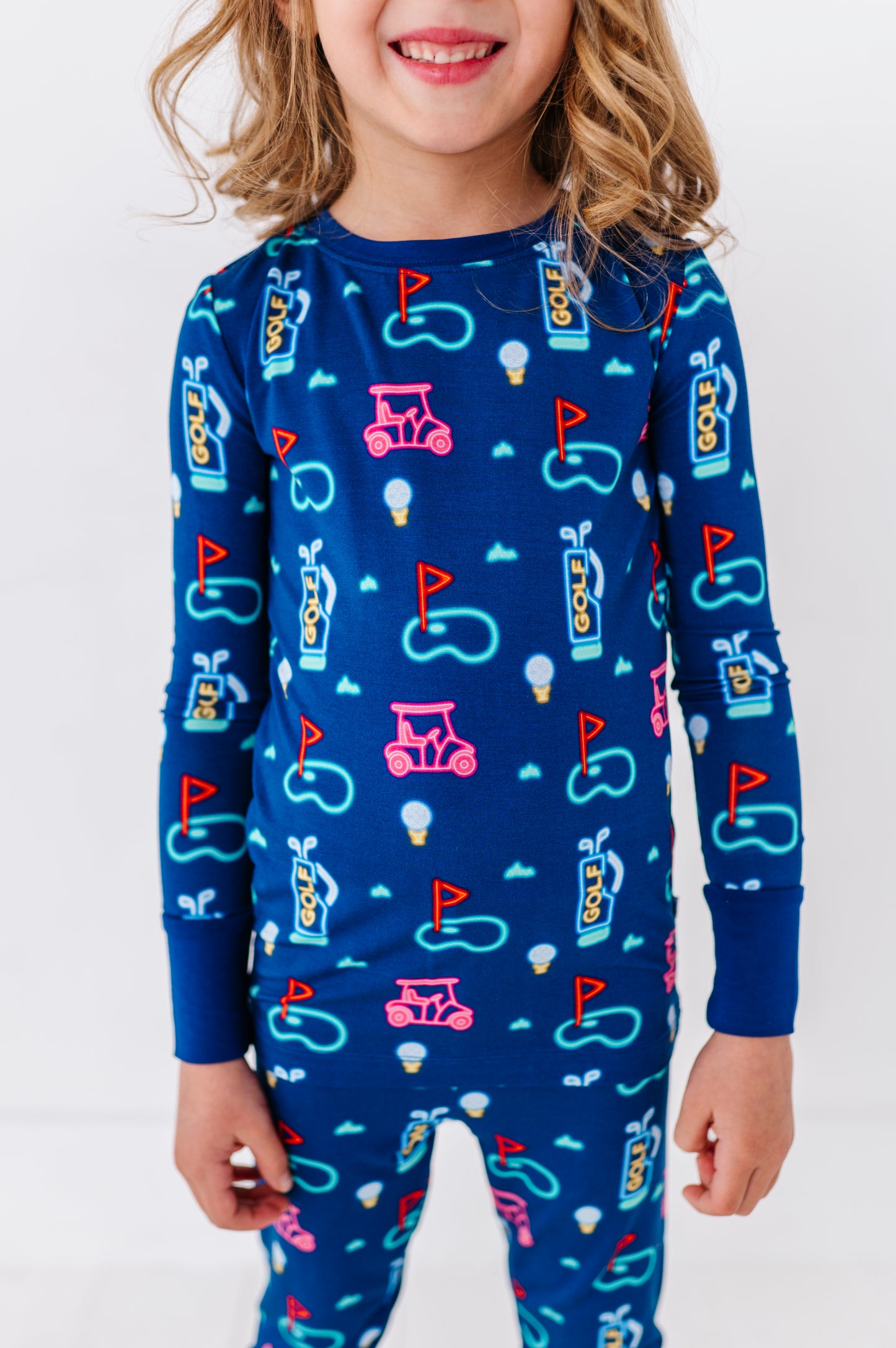 Girl in Neon Golf Pajamas by Kiki and Lulu