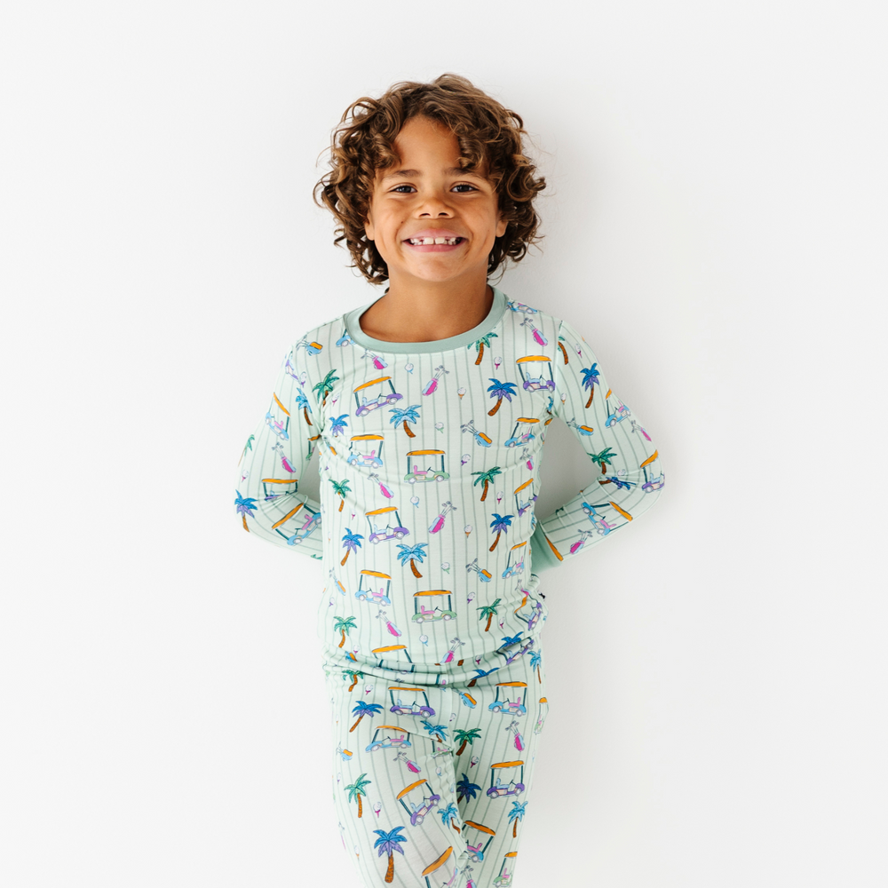 Kid in Golf Pajamas By Kiki and Lulu