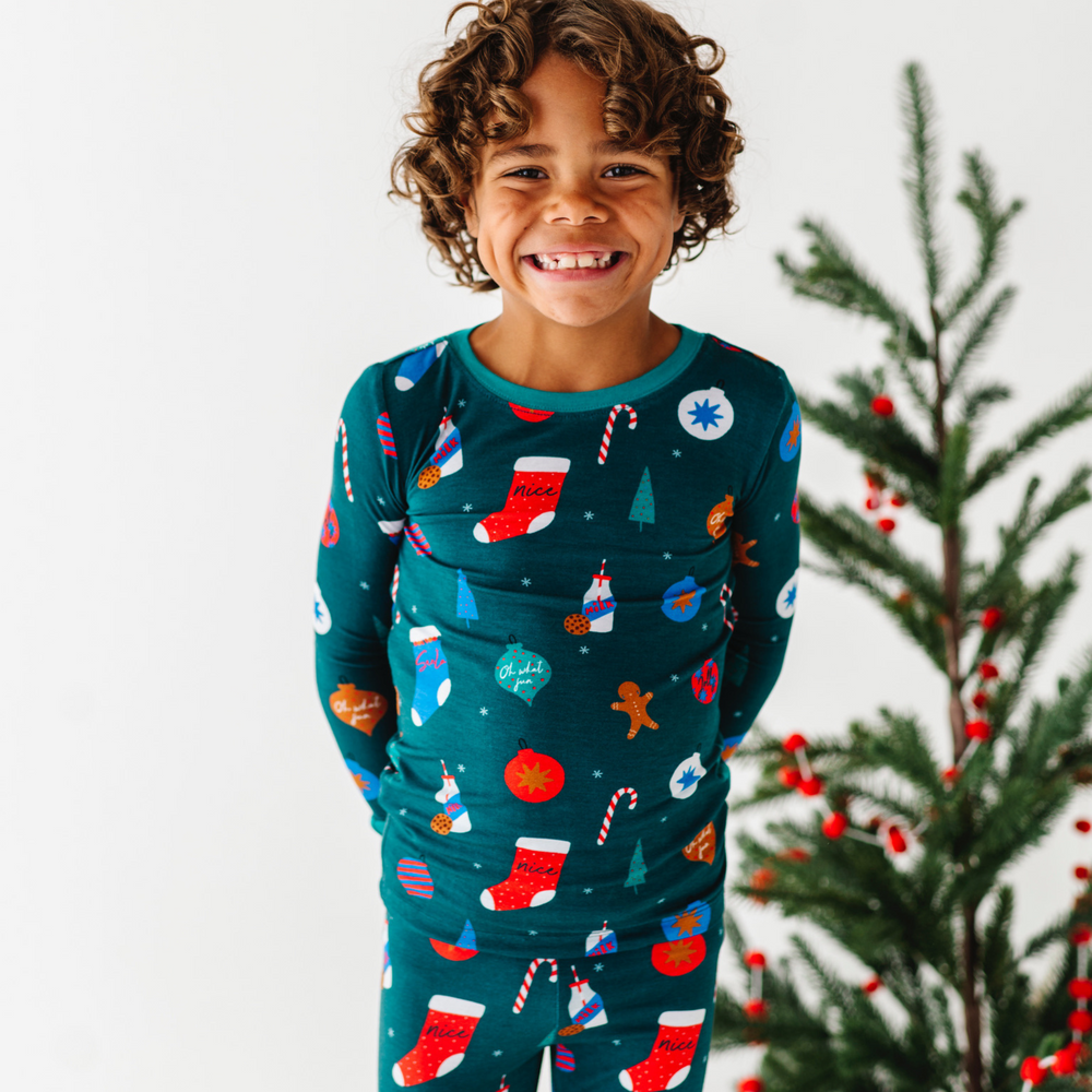 
                      
                        Boy in Green Christmas pajamas by Kiki and Lulu
                      
                    