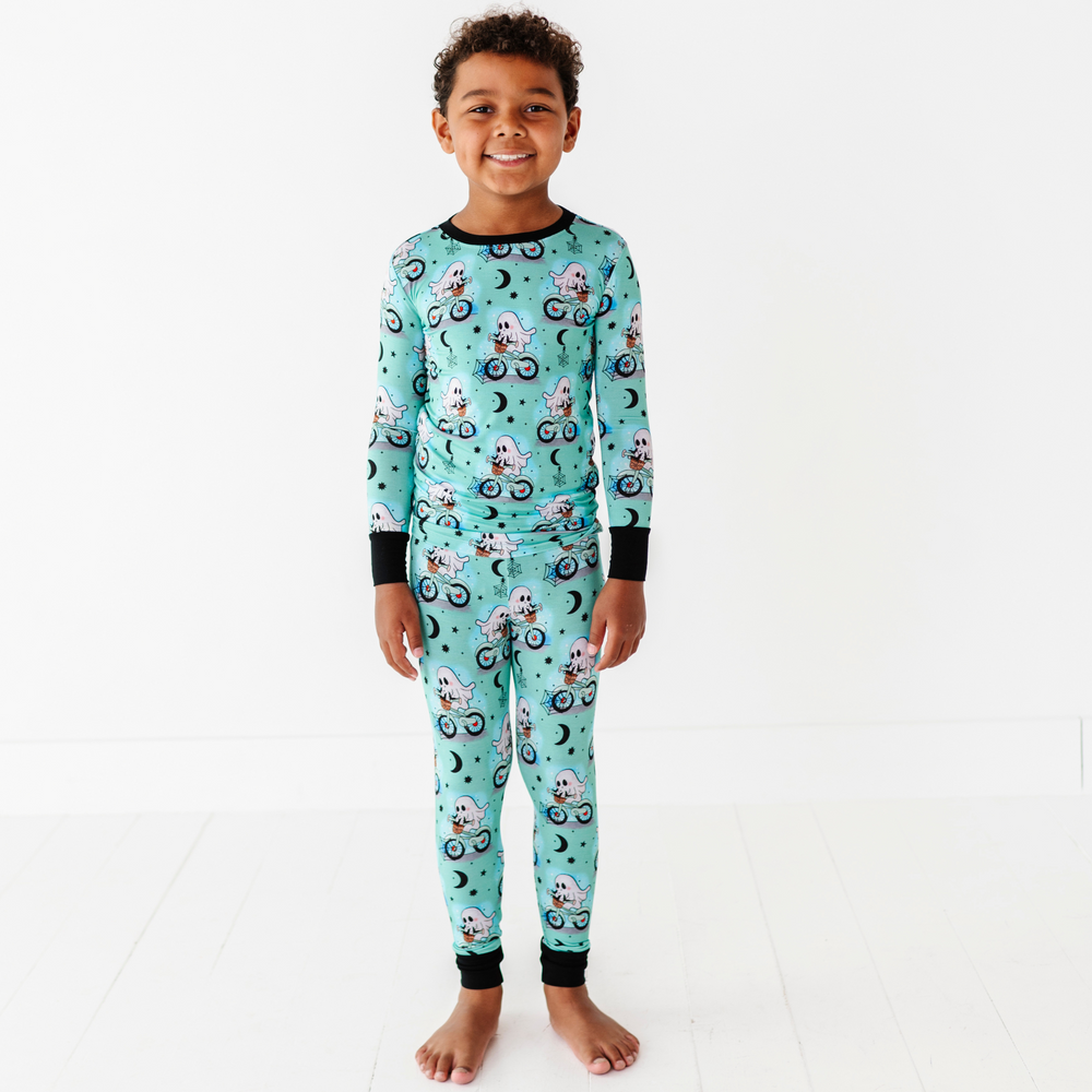 Boy wearing motorcycle ghost pajamas by Kiki and Lulu