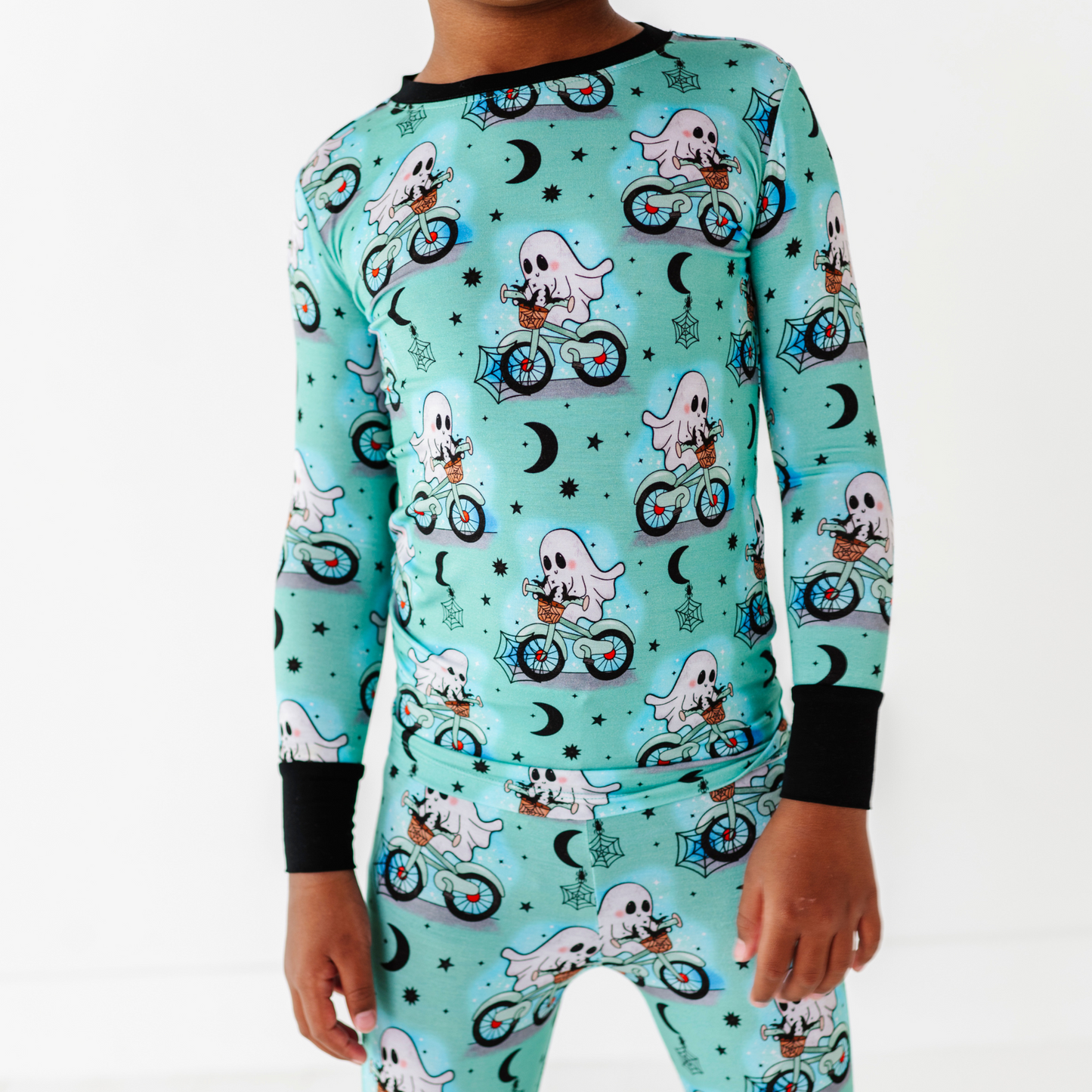 Boy wearing motorcycle ghost pajamas by Kiki and Lulu