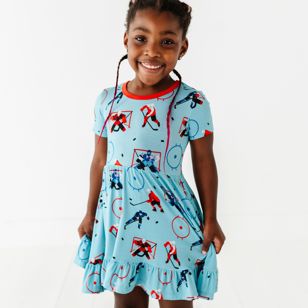 
                      
                        Girl wearing hockey dress by Kiki and Lulu
                      
                    