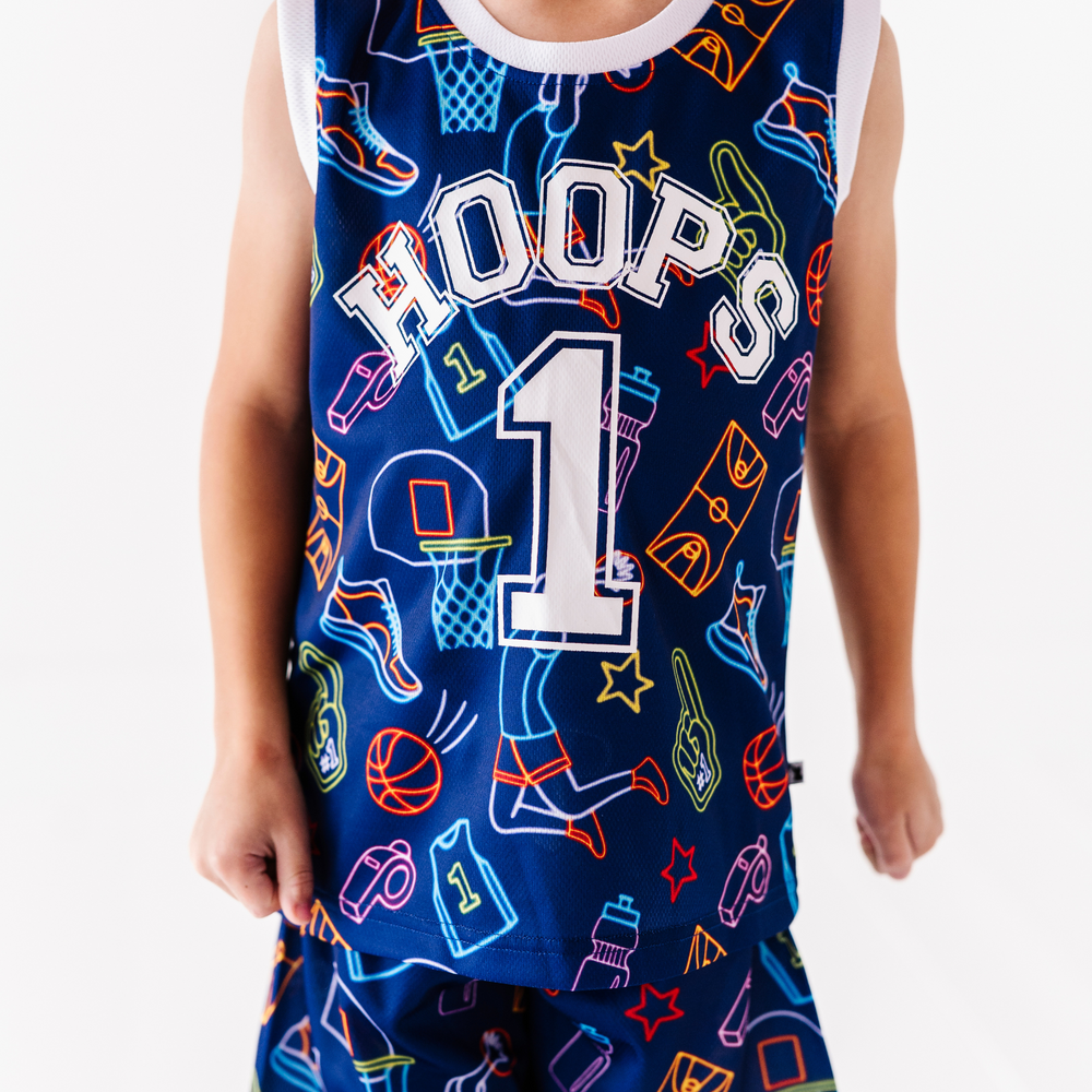 Boy in neon basketball jersey