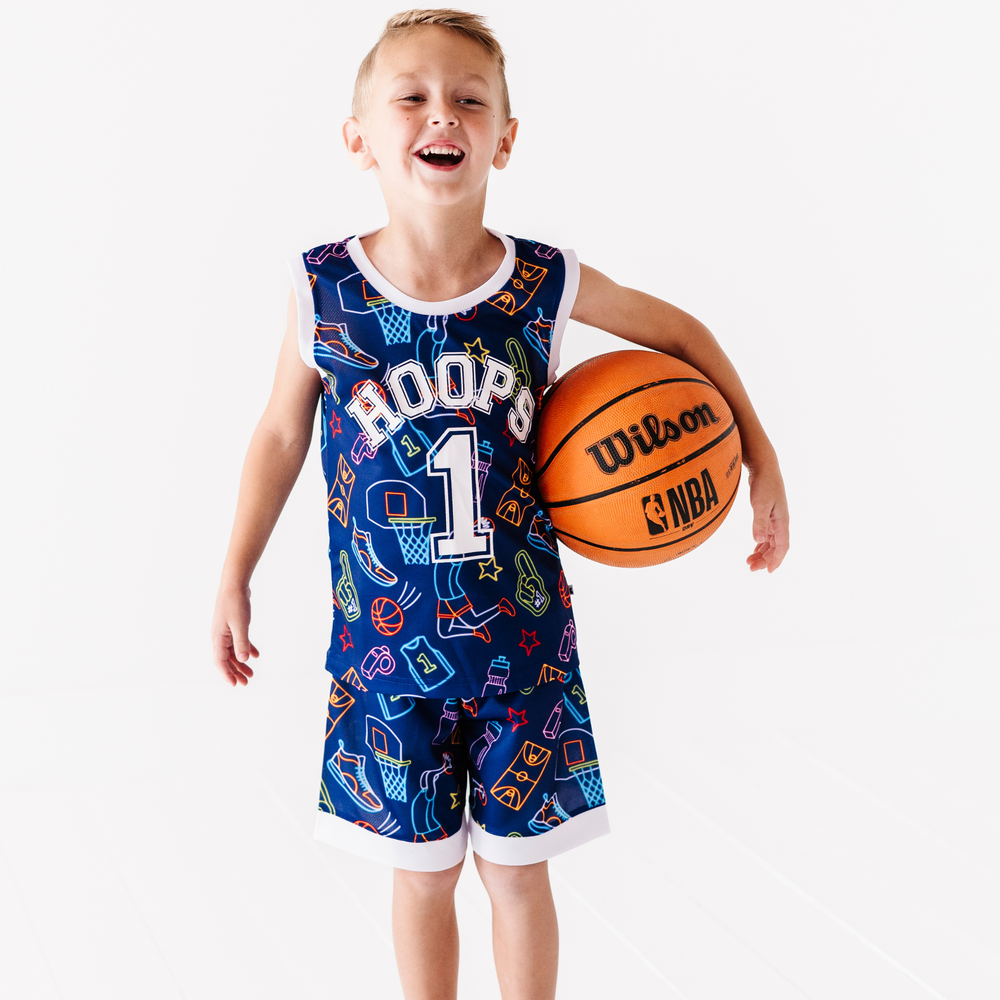 Boy in neon basketball jersey