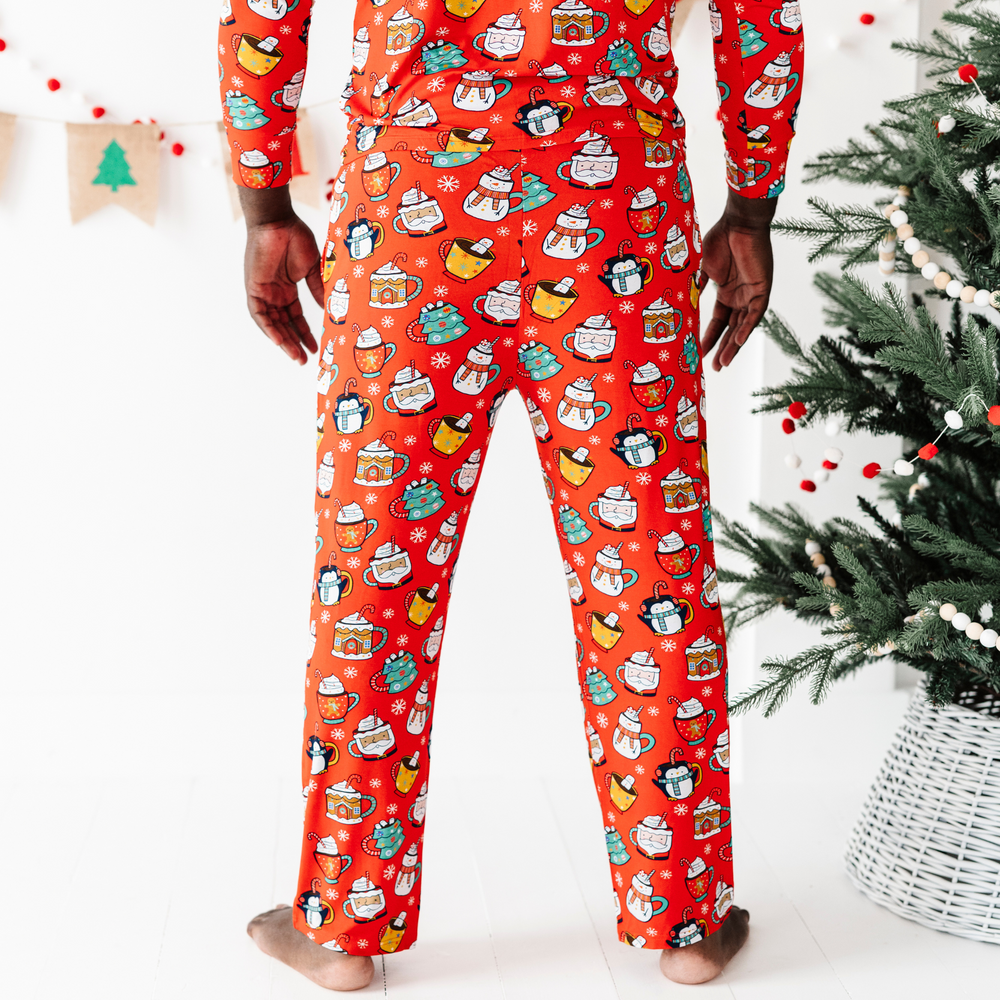 
                      
                        Man in family matching Christmas cocoa pajamasMan in family matching Christmas cocoa pajamas
                      
                    