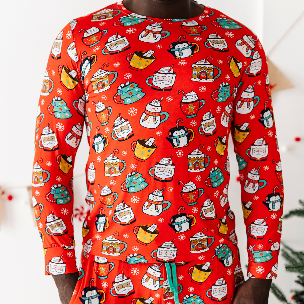 
                      
                        Man in family matching Christmas cocoa pajamas
                      
                    