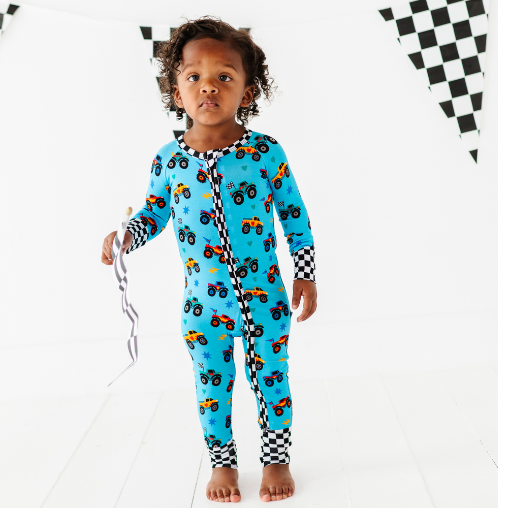 
                      
                        Boy wearing monster truck footies by Kiki and Lulu
                      
                    