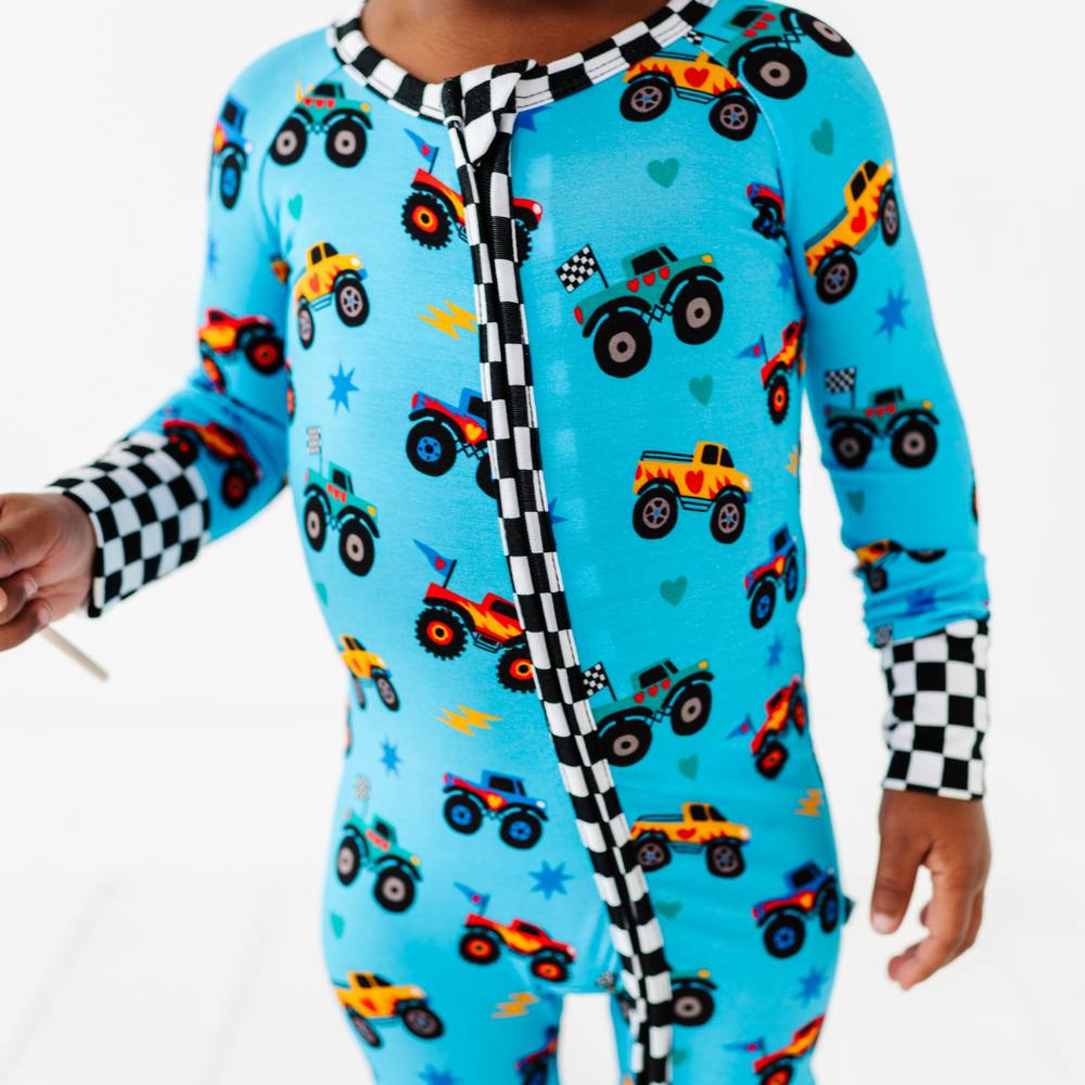 
                      
                        Boy wearing monster truck footies by Kiki and Lulu
                      
                    