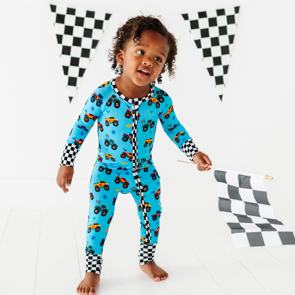 
                      
                        Boy wearing monster truck footies by Kiki and Lulu
                      
                    