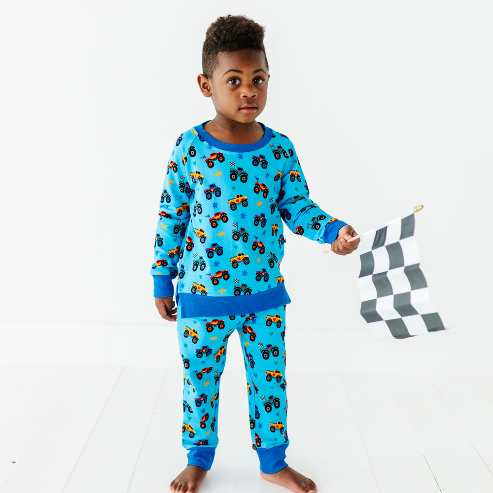 
                      
                        Kid wearing monster truck jogger set by Kiki and Lulu
                      
                    