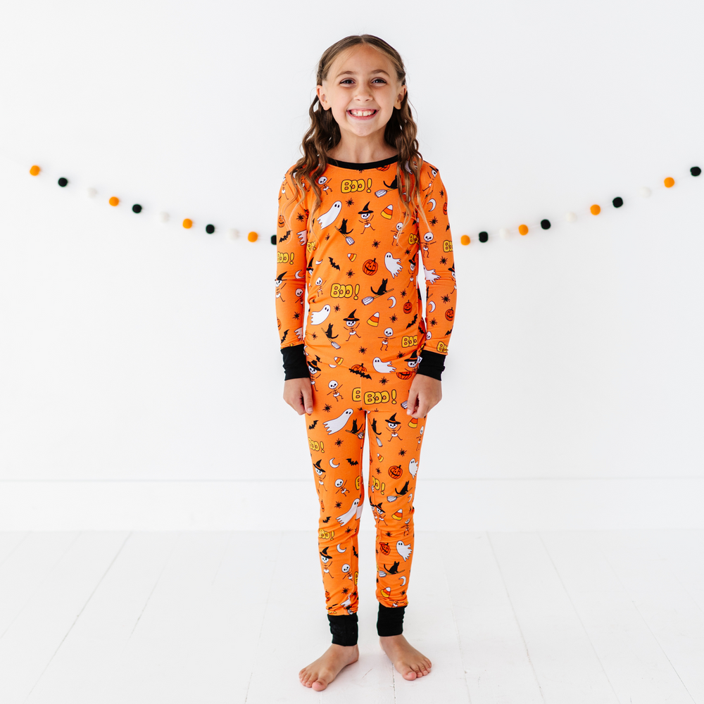 
                      
                        Girl in orange Halloween Pajamas
                      
                    