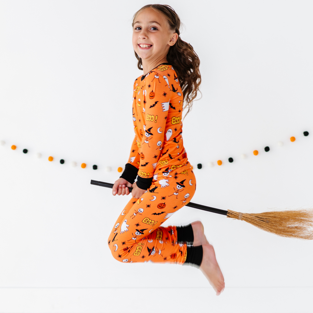 
                      
                        Girl in orange Halloween Pajamas
                      
                    