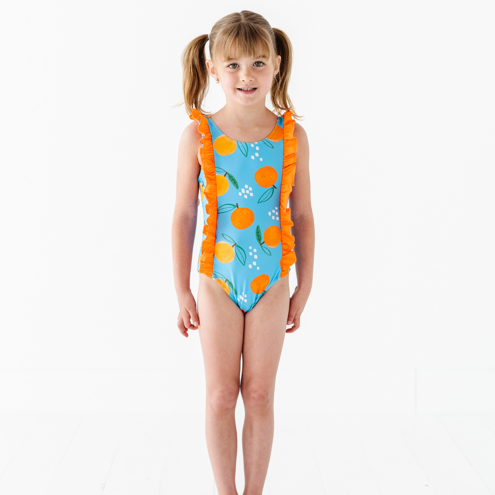 
                      
                        Be My Clementine Girls Swimsuit With Ruffle
                      
                    