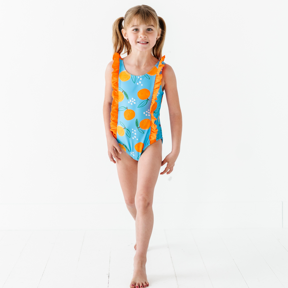 
                      
                        Be My Clementine Girls Swimsuit With Ruffle
                      
                    