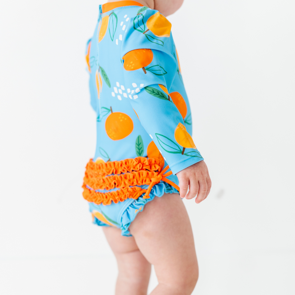 
                      
                        Be My Clementine Long Sleeve Ruffle Swimsuit
                      
                    