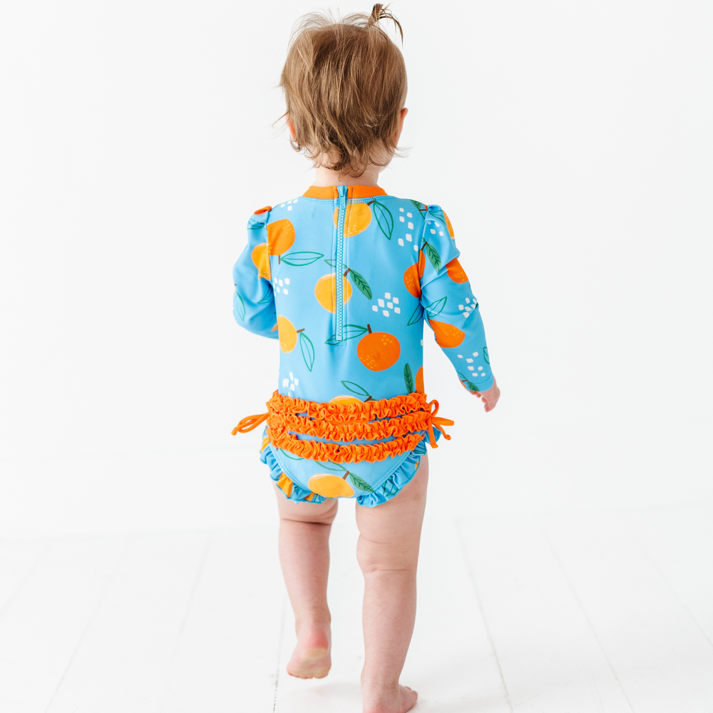 
                      
                        Be My Clementine Long Sleeve Ruffle Swimsuit
                      
                    