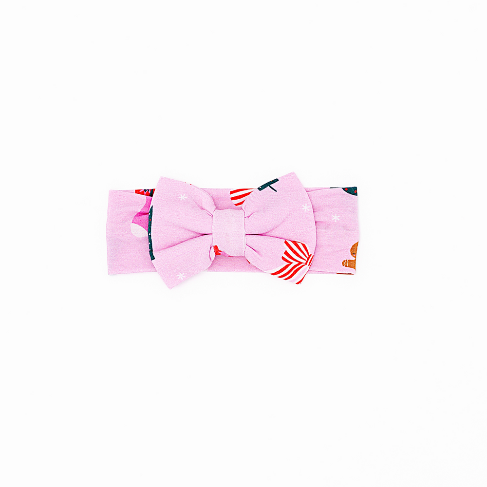 
                      
                        Baby in pink Christmas bow 
                      
                    