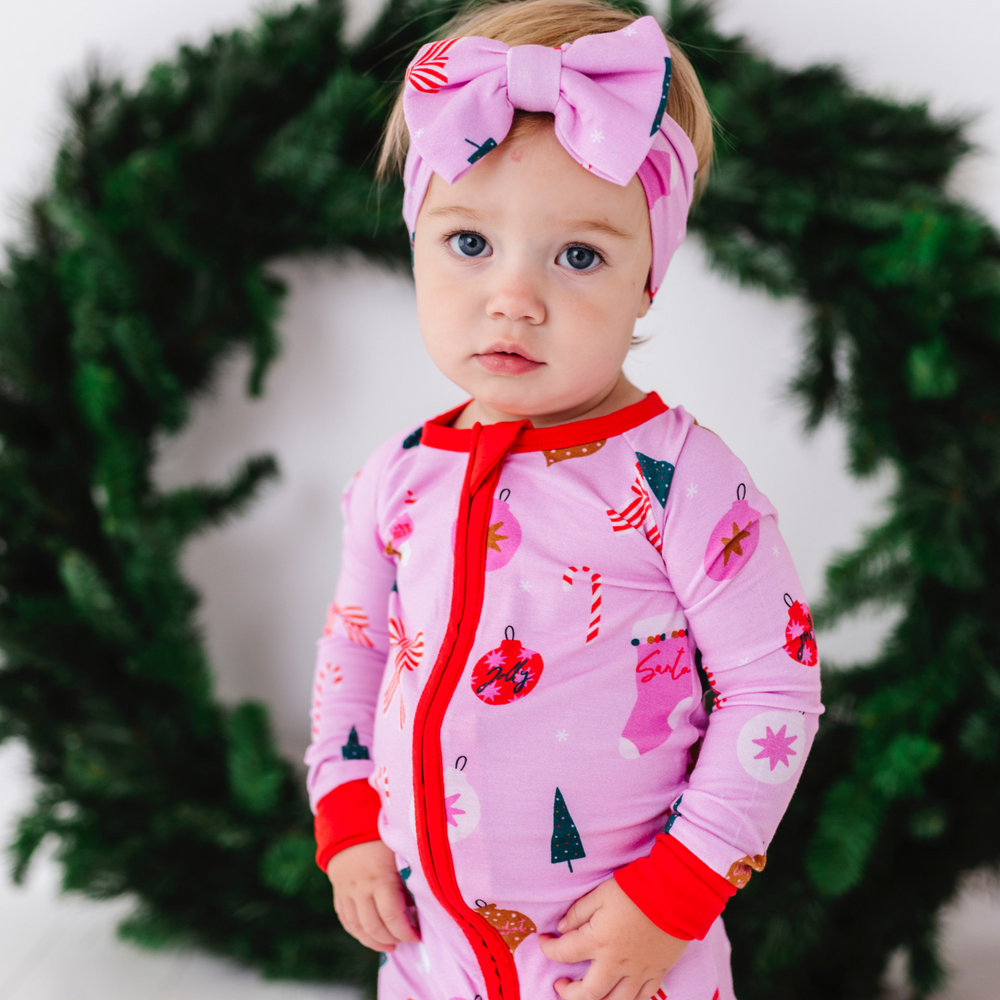 
                      
                        Baby in Pink Christmas pajamas by Kiki and Lulu
                      
                    