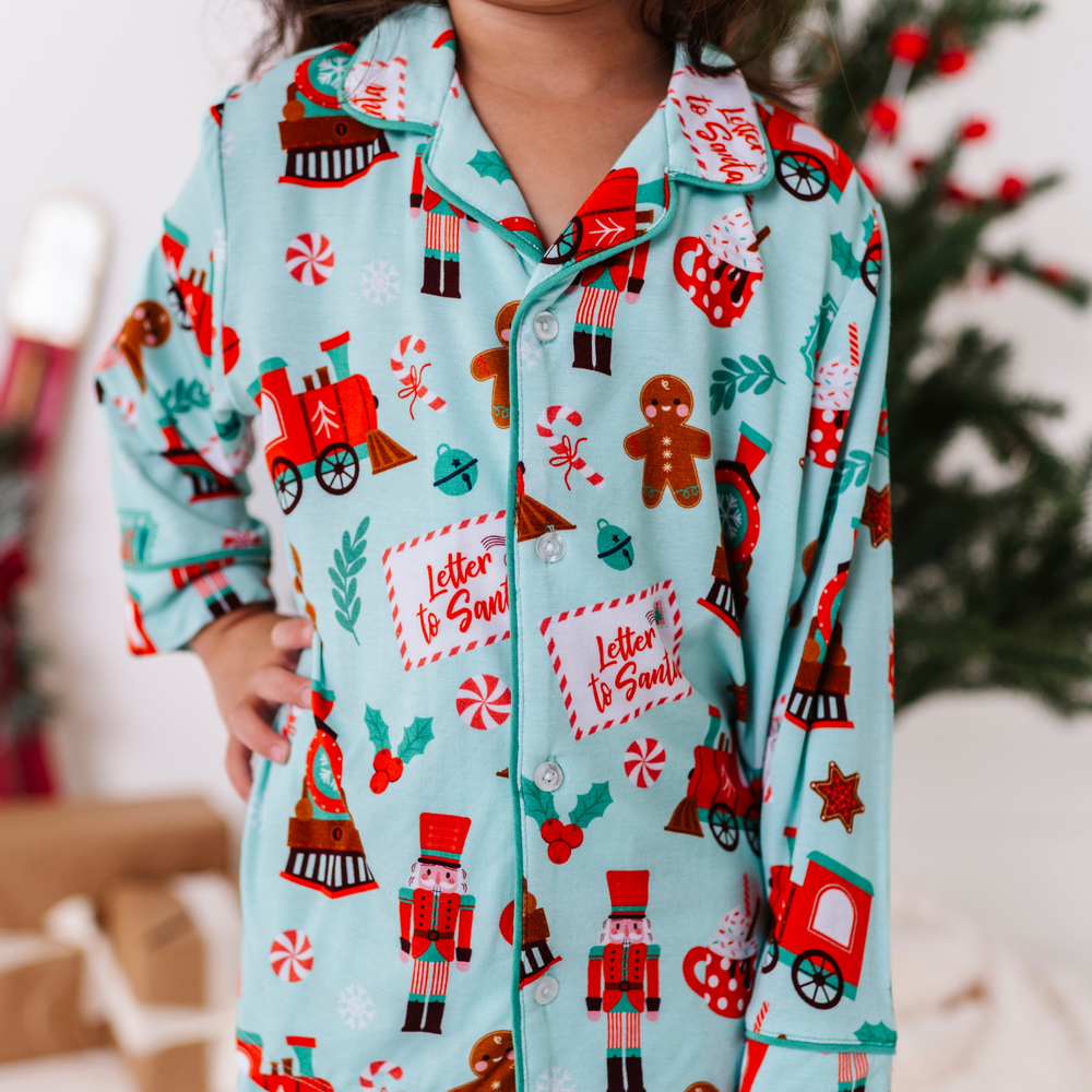 Girl in Christmas Train Pajamas