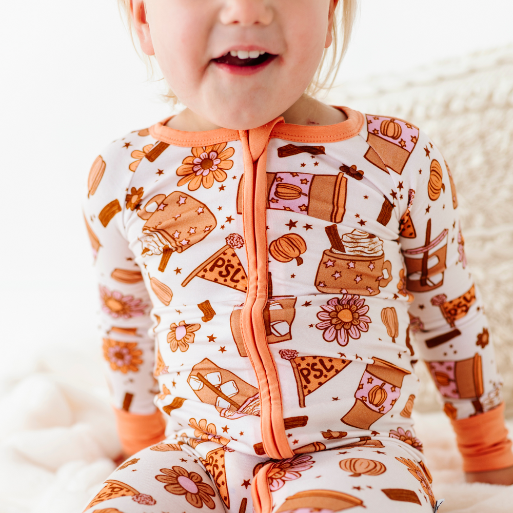 
                      
                        Baby in Pumpkin Spice Latte Pajamas by Kiki and Lulu
                      
                    