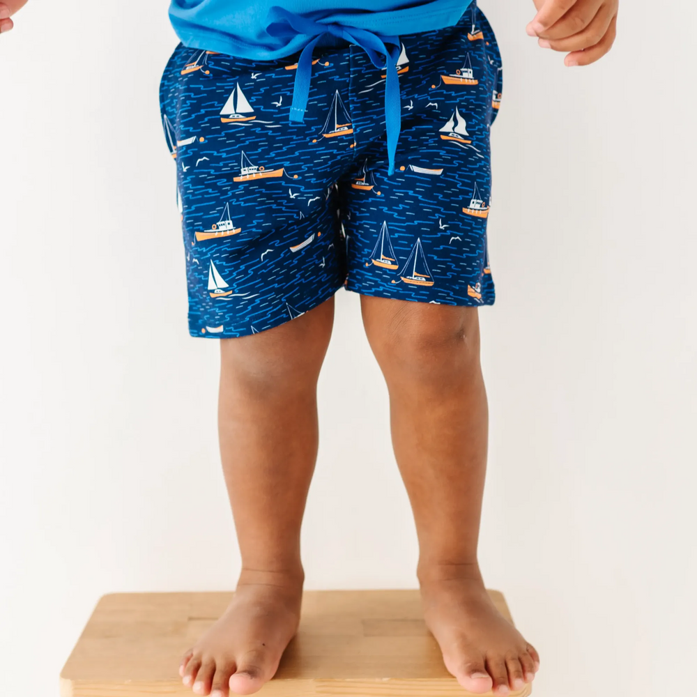 Boy in Sailboat shorts by Kiki and Lulu