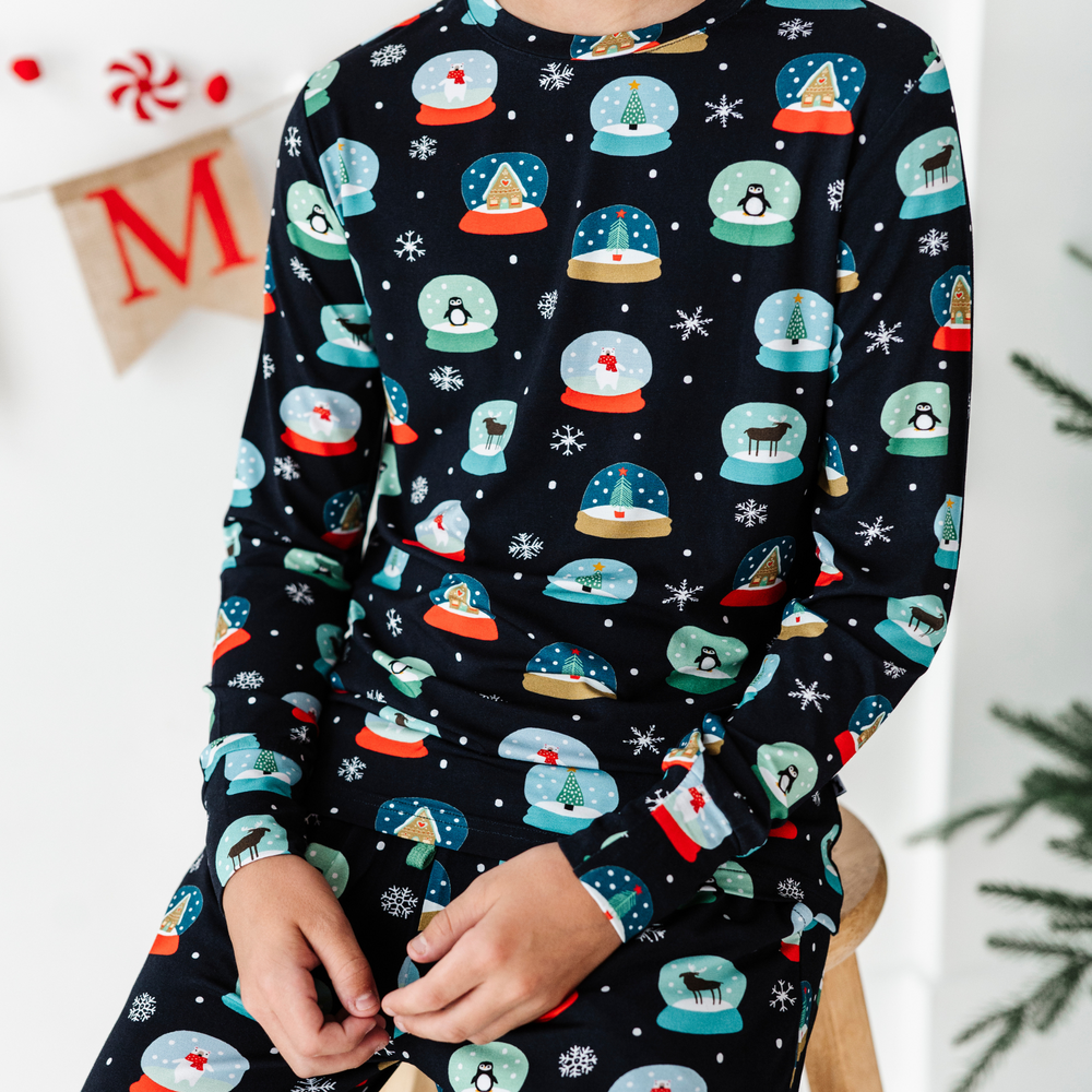 
                      
                        Boy in Kiki and Lulu Christmas Family Matching Snow Globe Pajamas
                      
                    