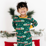 Toddler in Christmas train pajamas 